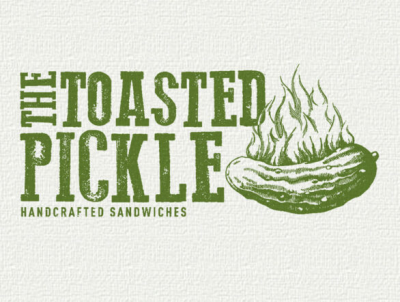 Logo of The Toasted Pickle featuring a pickle with flames and the text 'Handcrafted Sandwiches'.