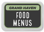 Sign displaying 'Grand Haven Food Menus' in a black and green design.